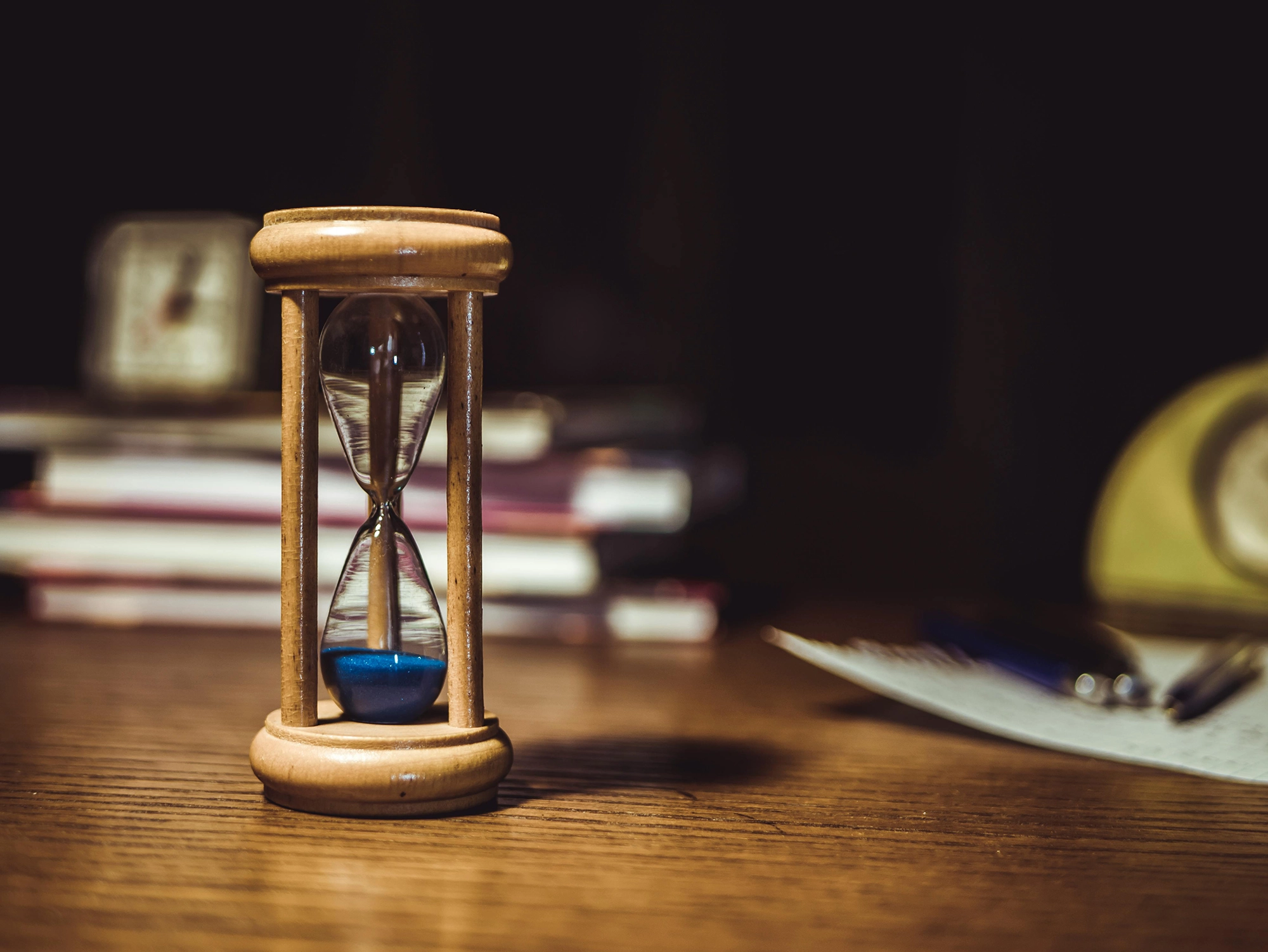 Hourglass with blue sand symbolizing the statute of limitations running out.