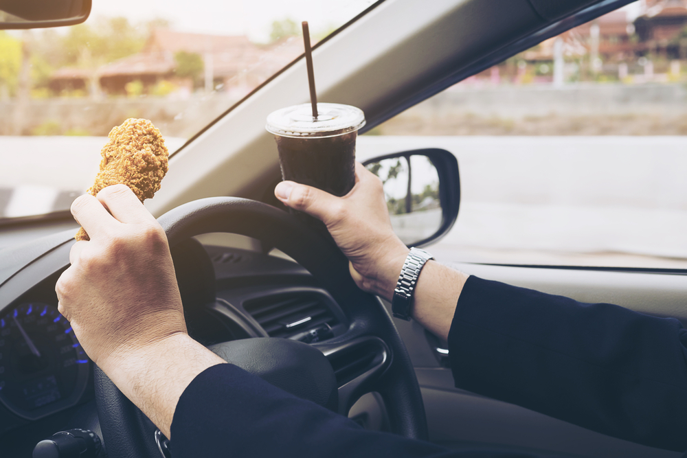Photo of Driving Car While Eating